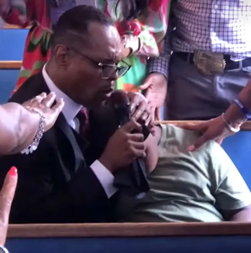 Members praying together at the altar